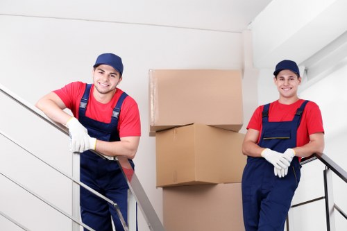 Professional team loading furniture items with care